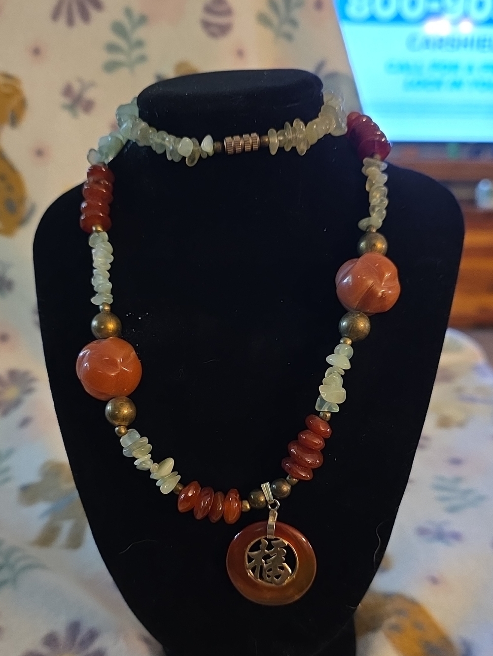 vintage beaded necklace featuring orange carnelian or agate stone beads